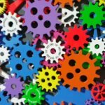 A colorful arrangement of gears symbolizing creativity, innovation, and machinery in vibrant colors.